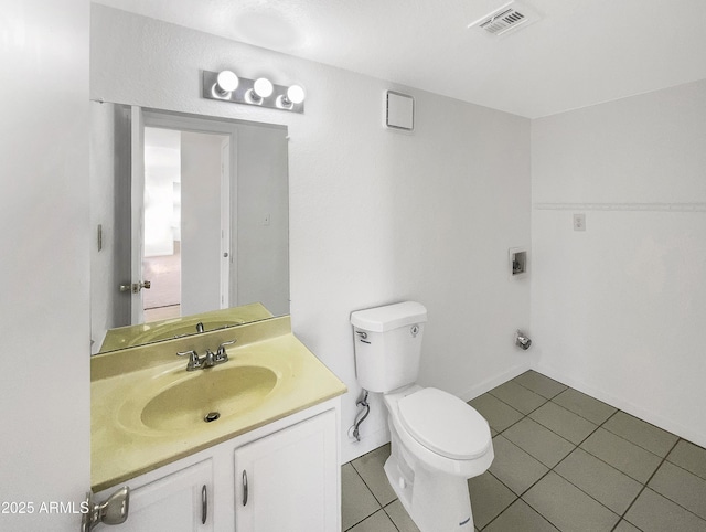 15650 N 19th Ave Unit 1206, Phoenix, AZ 85023 - bathroom with vanity, toilet, and tile patterned floors
