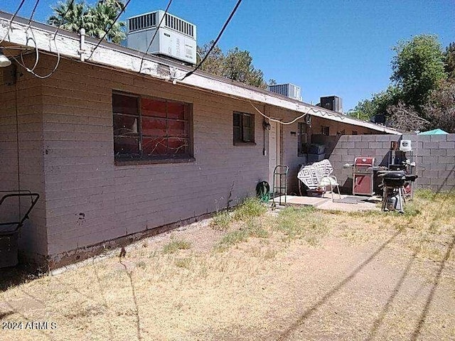 view of side of property with a patio area