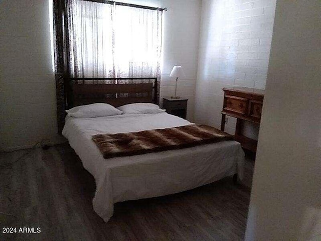 bedroom with hardwood / wood-style floors