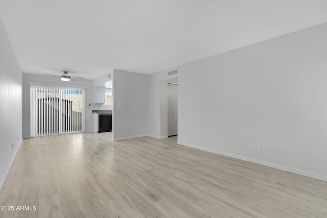 unfurnished living room featuring ceiling fan and light hardwood / wood-style flooring