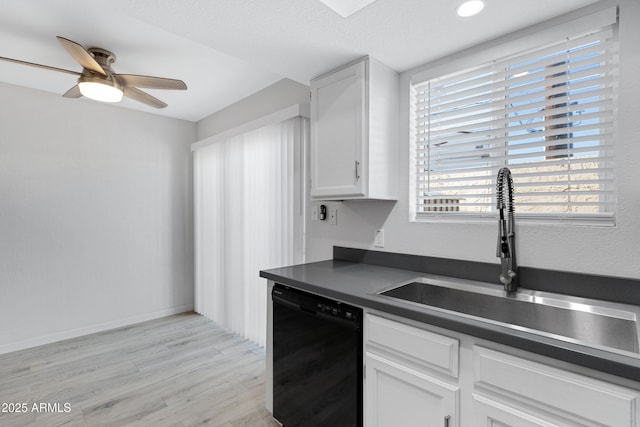 kitchen with dishwasher, light hardwood / wood-style floors, white cabinets, ceiling fan, and sink