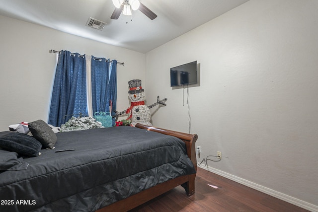 bedroom featuring ceiling fan and dark hardwood / wood-style flooring