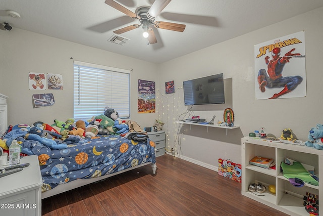 bedroom featuring dark hardwood / wood-style flooring and ceiling fan