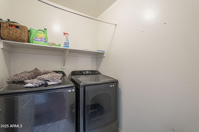 clothes washing area with independent washer and dryer