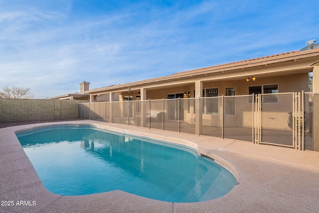 view of swimming pool with a fenced backyard and a fenced in pool