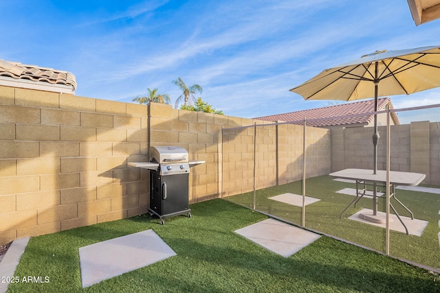 view of yard with a fenced backyard