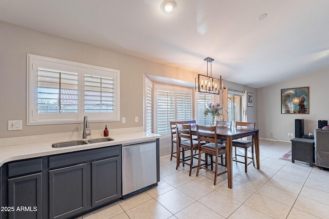 dining room featuring lofted ceiling, a chandelier, and light tile patterned flooring