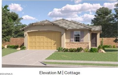 view of front of house featuring a garage and a front yard