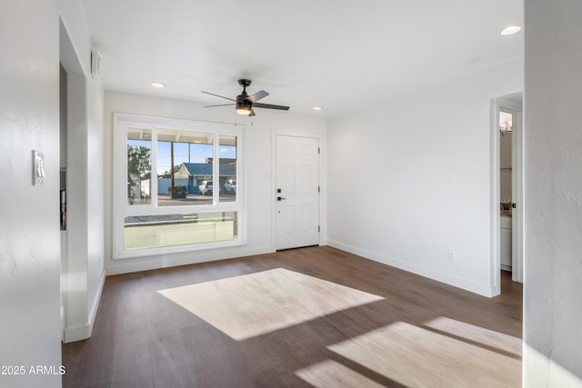 interior space with recessed lighting, baseboards, and wood finished floors