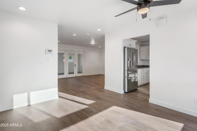 unfurnished room with recessed lighting, french doors, baseboards, and wood finished floors