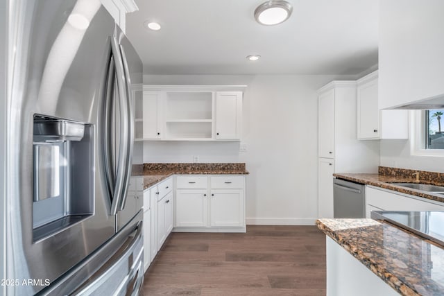 kitchen featuring dark wood-style floors, white cabinets, stainless steel appliances, and open shelves