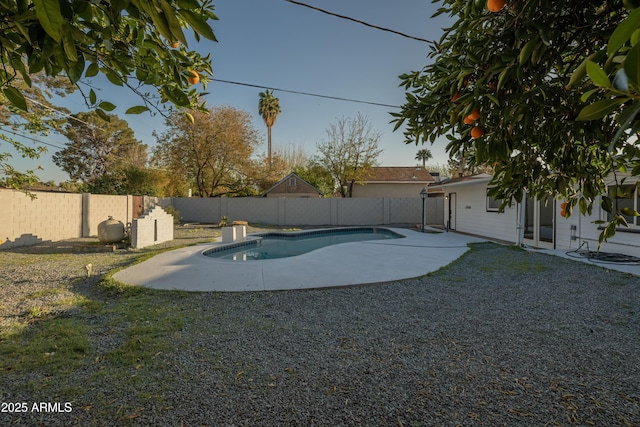 view of swimming pool featuring a patio area, a fenced in pool, and a fenced backyard