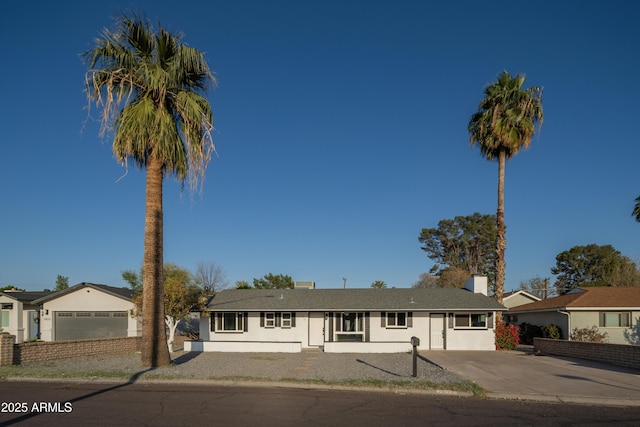 ranch-style home featuring stucco siding