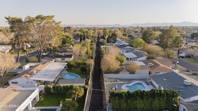 birds eye view of property with a mountain view and a residential view