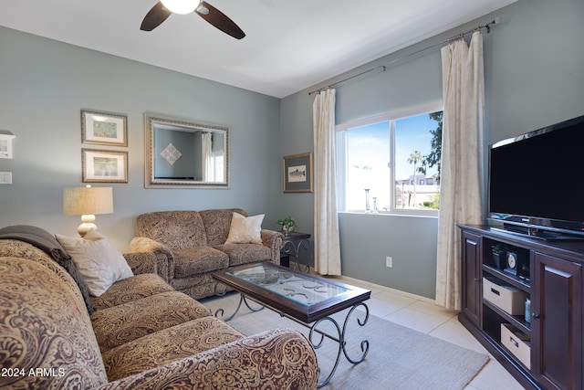 living room with ceiling fan and light tile patterned floors