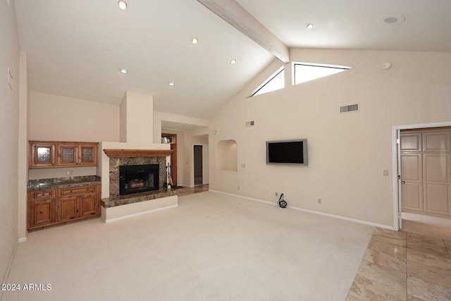 23014 N 86th St, Scottsdale, AZ 85255 - living room featuring visible vents, light carpet, high vaulted ceiling, beamed ceiling, and a fireplace