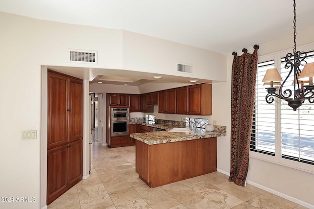 23014 N 86th St, Scottsdale, AZ 85255 - kitchen featuring stainless steel double oven, visible vents, a peninsula, and a sink