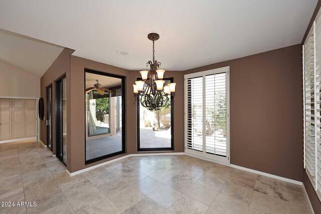 empty room with a notable chandelier