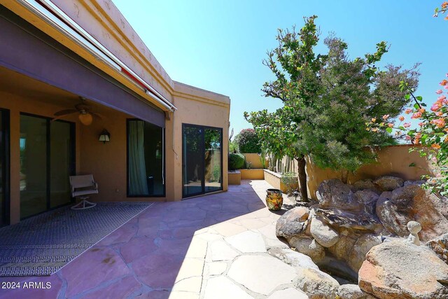 view of patio / terrace featuring ceiling fan