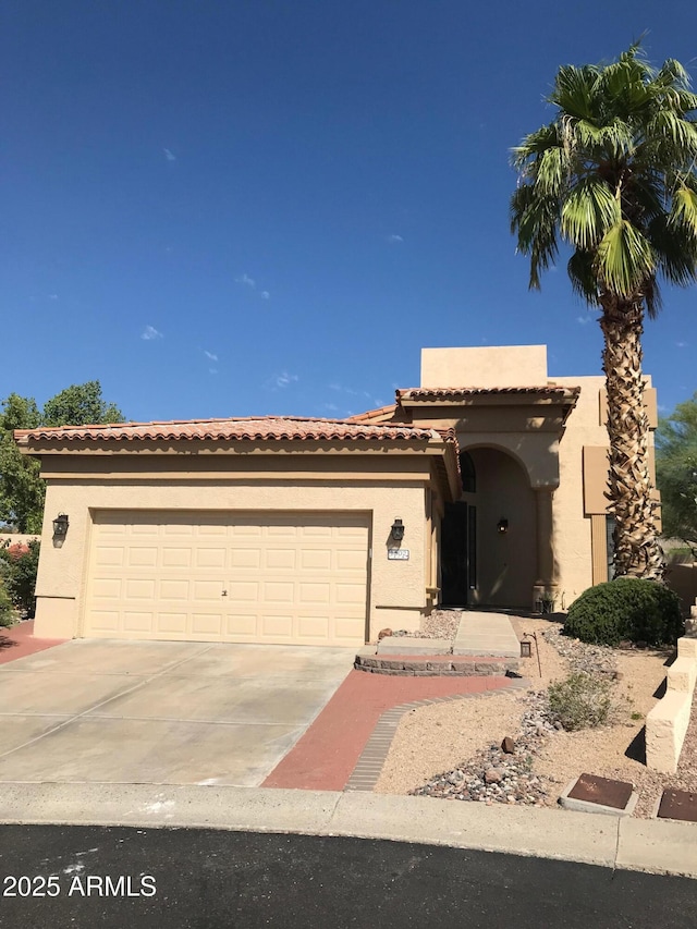 1502 E Estrid Ave, Phoenix, AZ 85022 - view of front of home with driveway, stucco siding, and an attached garage