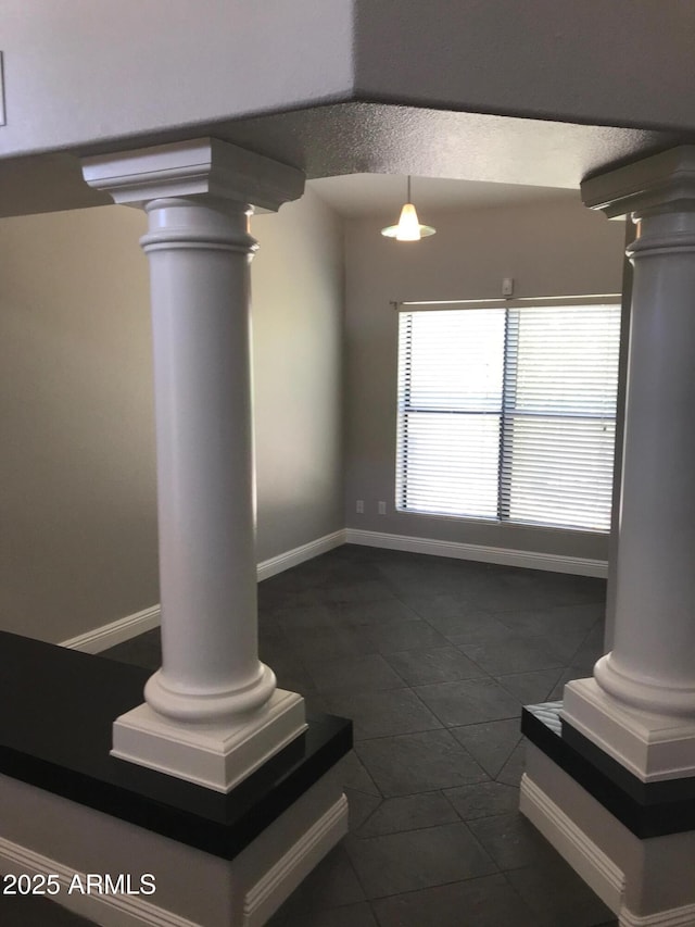 1502 E Estrid Ave, Phoenix, AZ 85022 - unfurnished living room with ornate columns and dark tile patterned floors