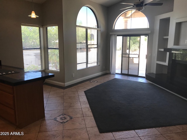 1502 E Estrid Ave, Phoenix, AZ 85022 - doorway to outside with built in shelves, plenty of natural light, tile patterned flooring, and a high ceiling