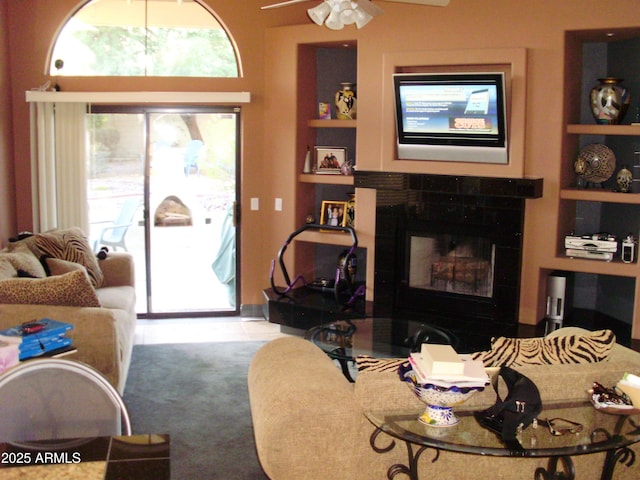 1502 E Estrid Ave, Phoenix, AZ 85022 - living area featuring a tiled fireplace and ceiling fan