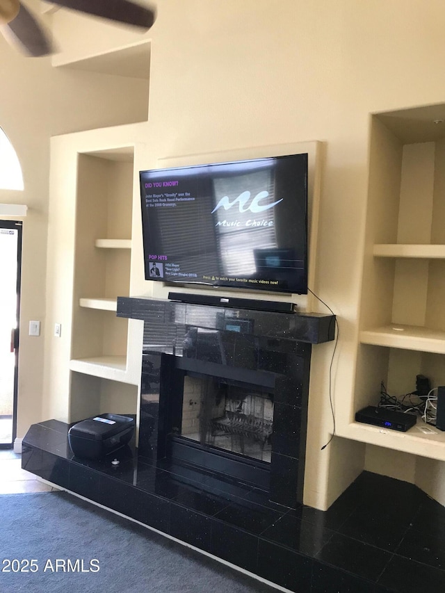1502 E Estrid Ave, Phoenix, AZ 85022 - detailed view of built in shelves, a tile fireplace, and carpet flooring