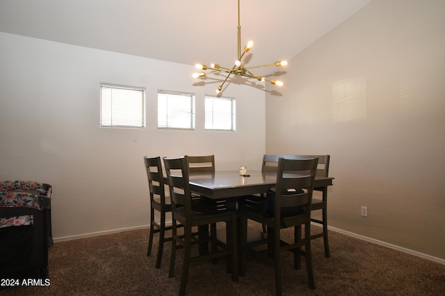 dining room with dark colored carpet, lofted ceiling, and a notable chandelier