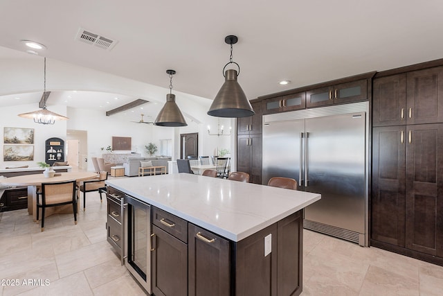 2724 W Colt Rd, Chandler, AZ 85224 - kitchen featuring stainless steel built in refrigerator, beverage cooler, a ceiling fan, open floor plan, and hanging light fixtures