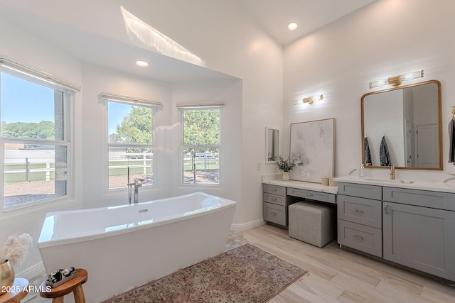 2724 W Colt Rd, Chandler, AZ 85224 - full bathroom featuring vanity, a freestanding bath, baseboards, and recessed lighting