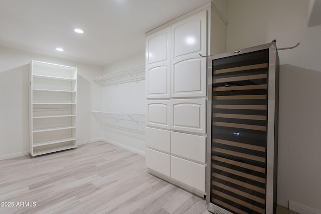 2724 W Colt Rd, Chandler, AZ 85224 - spacious closet featuring beverage cooler and light wood-style floors