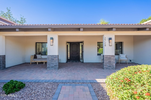 2724 W Colt Rd, Chandler, AZ 85224 - doorway to property with stucco siding, a patio, and a tile roof