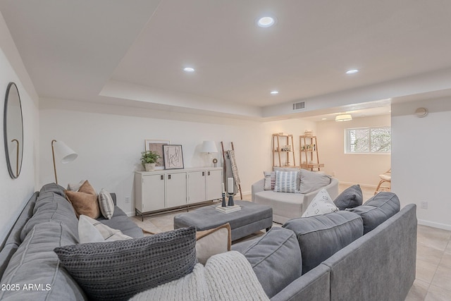 2724 W Colt Rd, Chandler, AZ 85224 - living room with recessed lighting, light tile patterned floors, a tray ceiling, and baseboards