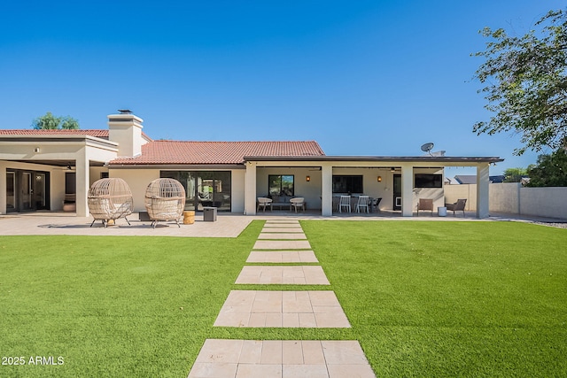 2724 W Colt Rd, Chandler, AZ 85224 - rear view of house featuring ceiling fan, a chimney, a tiled roof, and a patio area
