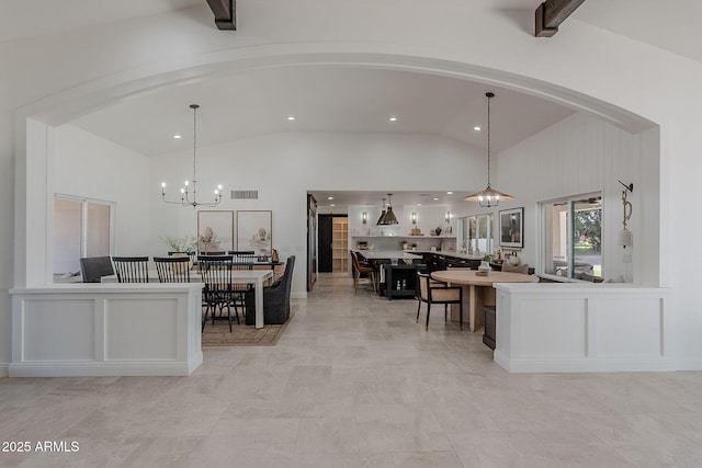 2724 W Colt Rd, Chandler, AZ 85224 - kitchen with lofted ceiling, a chandelier, arched walkways, recessed lighting, and decorative light fixtures