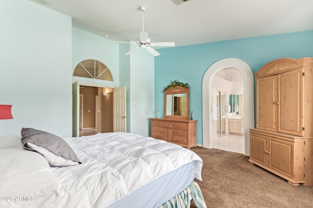 251 E Arabian Dr, Gilbert, AZ 85296 - bedroom featuring light colored carpet, ensuite bathroom, a ceiling fan, and a high ceiling