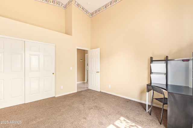 251 E Arabian Dr, Gilbert, AZ 85296 - unfurnished bedroom with carpet, a towering ceiling, baseboards, and a closet