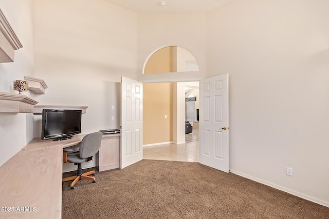 251 E Arabian Dr, Gilbert, AZ 85296 - carpeted home office featuring a high ceiling, baseboards, and tile patterned flooring