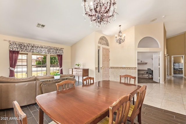 251 E Arabian Dr, Gilbert, AZ 85296 - dining space with a chandelier, vaulted ceiling, and wood finish floors