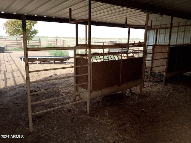 view of stable featuring a rural view