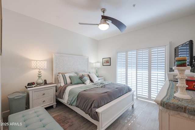 bedroom featuring ceiling fan and dark wood-type flooring