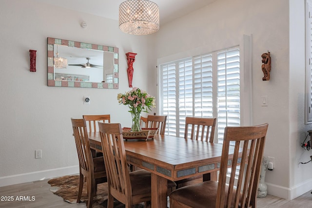 dining room featuring ceiling fan and light hardwood / wood-style floors