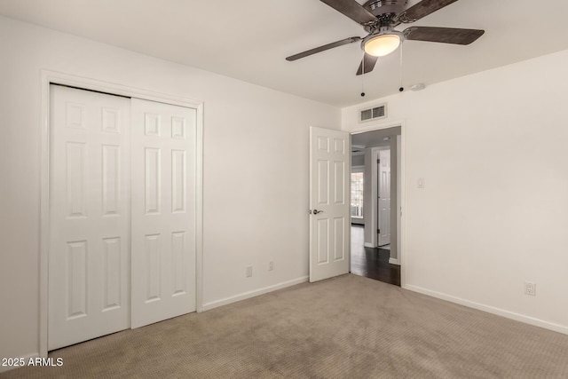 6820 E Pinchot Ave, Scottsdale, AZ 85251 - unfurnished bedroom featuring carpet, a closet, and a ceiling fan