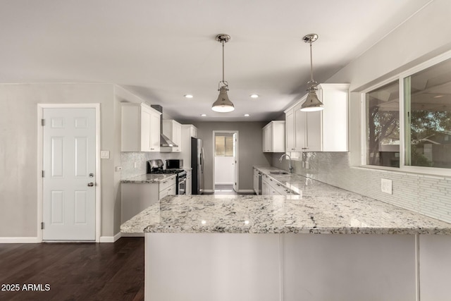 6820 E Pinchot Ave, Scottsdale, AZ 85251 - kitchen featuring stainless steel appliances, under cabinet range hood, tasteful backsplash, white cabinetry, and recessed lighting