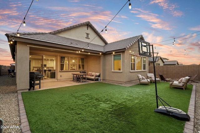 6954 W Maya Way, Peoria, AZ 85383 - back of property with an outdoor living space, a fenced backyard, and stucco siding