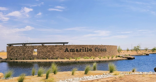 community sign with a water view