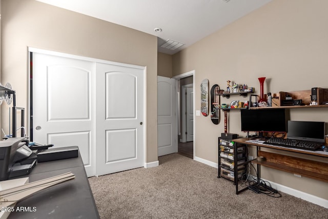 carpeted office space featuring baseboards