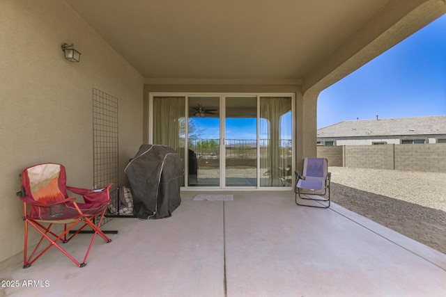 view of patio featuring fence