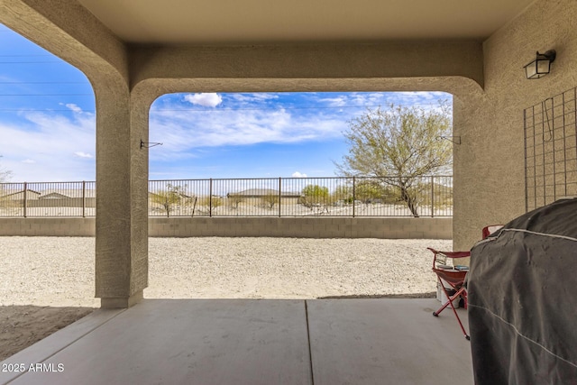 view of patio featuring a fenced backyard and a grill
